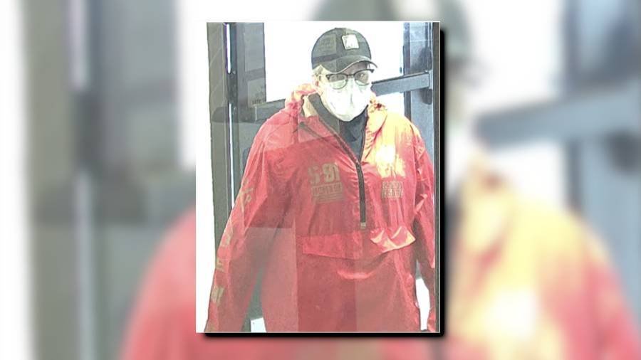 Article image for FBI seeks failed bank robber who donned an orange raincoat